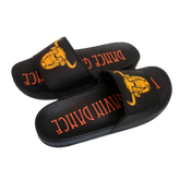 A pair of black slip-on slides with the Dance Gavin Dance logo printed on the sole and the image of a character's head printed on the top.