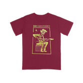 Maroon t-shirt with yellow graphic and text on a white background