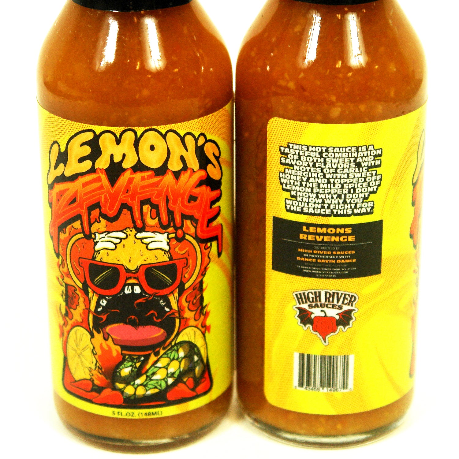 image of a hot sauce bottle on a white background. hot sauce says label says lemon's revenge with a lemon wearing sunglasses surrounded by fire. side view of the label's description