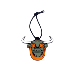 An enamel ornament in the shape of a bull's head with black horns and orange body, with a string for hanging.