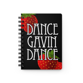 A spiral-bound notebook with a black cover featuring the phrase 'DANCE GAVIN DANCE' in large white letters and illustrated red strawberries at the top left and bottom right, shown on a plain white background.
